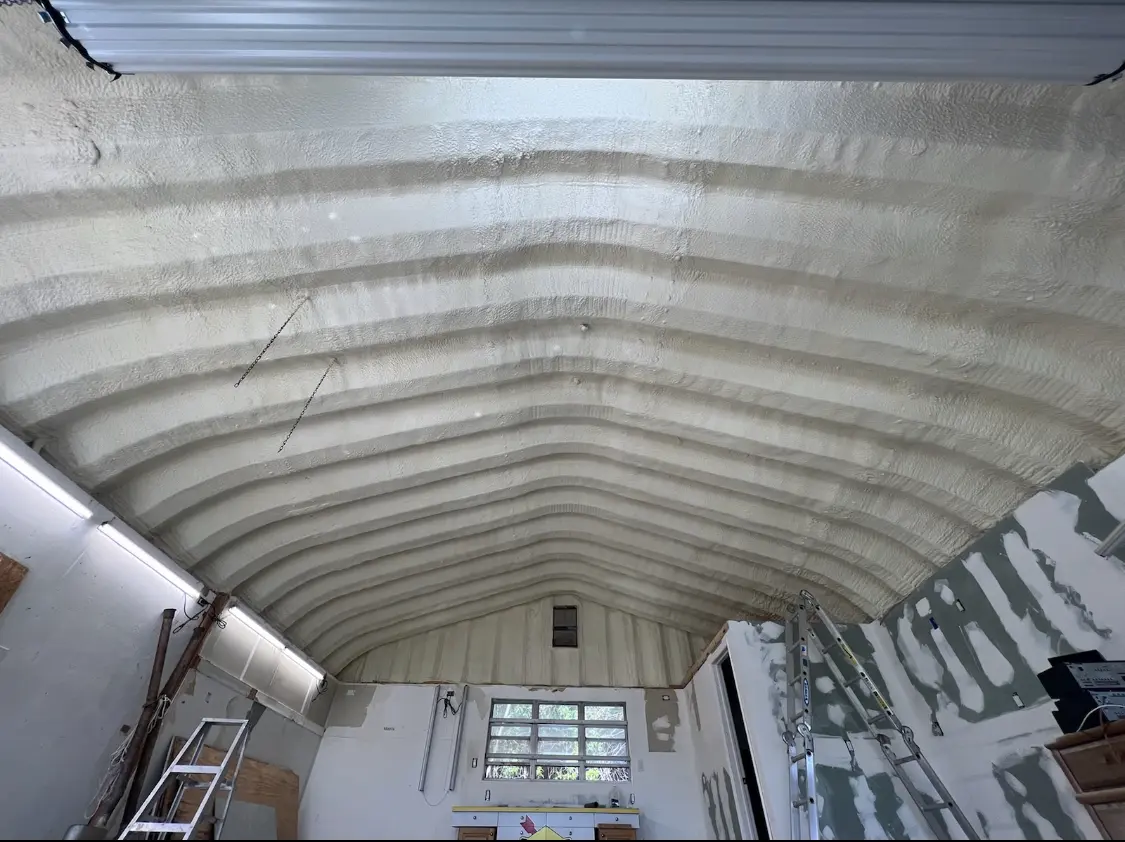 Spray polyurethane foam applied to the underside of a metal roof deck in Elyria